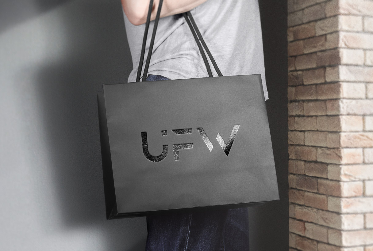 Unfolloworld branding by Reform Digital, logo mockup on shopping bag